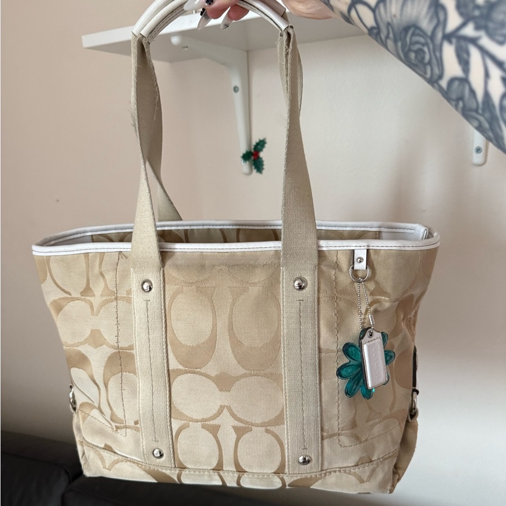Coach Tan Signature Canvas Tote with Teal Flower Charm